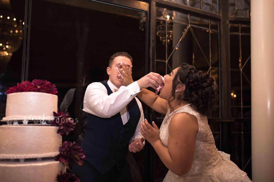 Sociably Yours - Bride and Groom Feeding Each other Cake